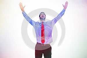 Composite image of happy cheering businessman raising his arms