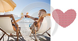 Composite image of happy couple clinking their glasses while relaxing on their deck chairs