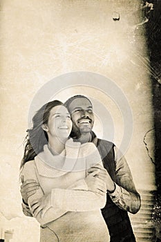 Composite image of happy couple embracing each other