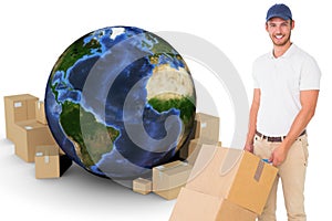 Composite image of happy delivery man pushing trolley of boxes