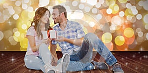 Composite image of happy man giving gift to woman