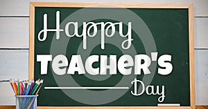 Composite image of happy teacher\'s day text on greenboard in school