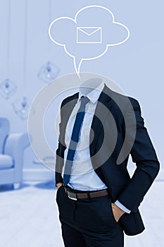 Composite image of headless businessman with hands in pockets
