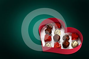 Composite image of heart shaped box of candy