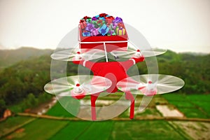 Composite image of high angle view of drone pulling chirstmas sledge