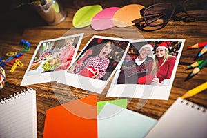 Composite image of high angle view of office supplies and blank instant photos