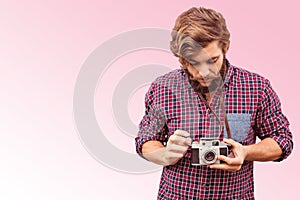 Composite image of hipster using camera