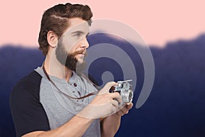 Composite image of hipster using digital camera