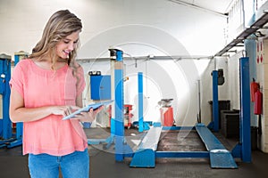 Composite image of hipster woman holding tablet pc