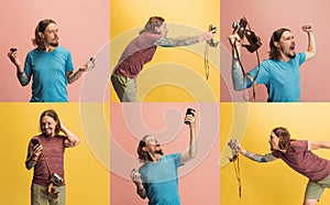 Composite image of images of young man, photographer with retro camera isolated on yellow and pink studio background.