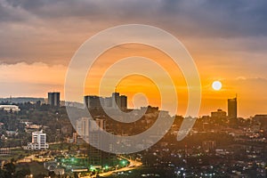 A composite image of Kigali city centre skyline and surrounding in daylight, sunset and at night. Rwanda