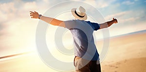 Composite image of low angle of a man raising arms up