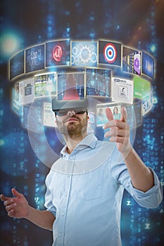 Composite image of low angle view of man using oculus rift headset 3d photo