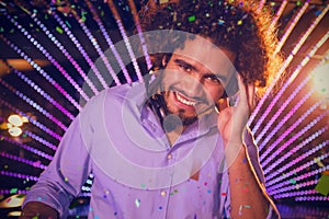 Composite image of male dj playing music