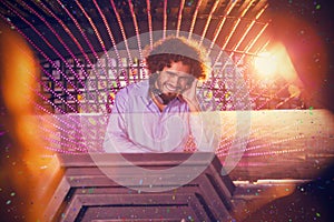 Composite image of male dj playing music