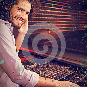 Composite image of male dj playing music