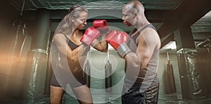 Composite image of male and female boxer with fighting stance