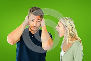 Composite image of man not listening to his shouting girlfriend