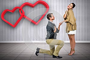 Composite image of man proposing woman while kneeling