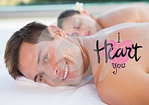 Composite image of man at spa with valentines text