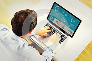 Composite image of man using laptop