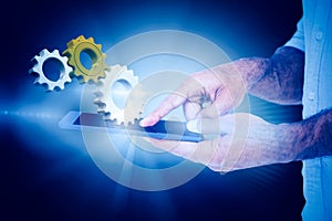 Composite image of a man using tablet computer