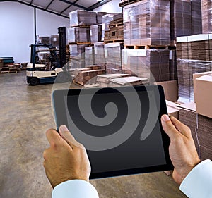 Composite image of man using tablet pc