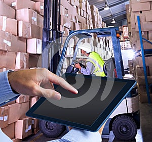 Composite image of man using tablet pc