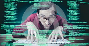 Composite image of man wearing eye glasses typing on computer keyboard