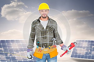 Composite image of manual worker holding various tools