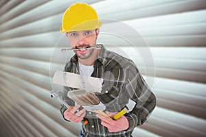 Composite image of manual worker holding various tools