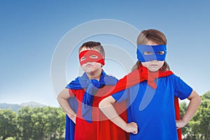 Composite image of masked kids pretending to be superheroes