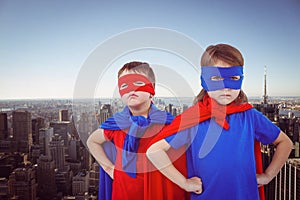 Composite image of masked kids pretending to be superheroes