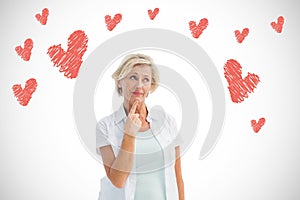 Composite image of mature woman thinking with hand on chin