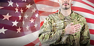 Composite image of mid section of soldier taking oath