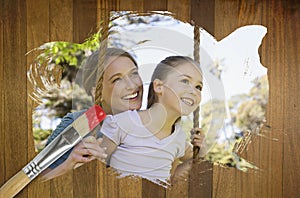 Composite image of mother and daughter in the park