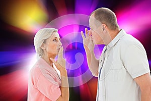Composite image of older couple holding hands to mouth for silence