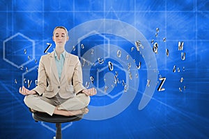 Composite image of peaceful chic businesswoman sitting in lotus position on swivel chair