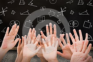 Composite image of people raising hands in the air