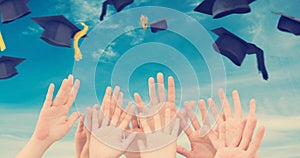 Composite image of people raising hands in the air