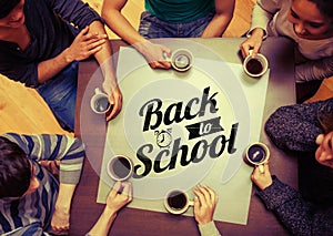Composite image of people sitting around table drinking coffee
