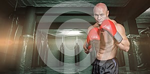Composite image of portrait of boxer with gloves