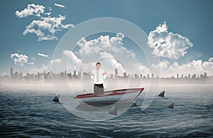 Composite image of portrait of a clueless businessman posing in a sailboat