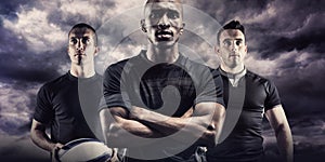 Composite image of portrait of confident rugby player with arms crossed