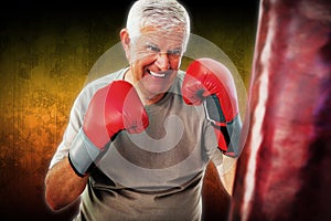 Composite image of portrait of a determined senior boxer