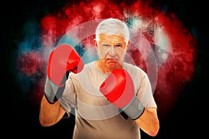 Composite image of portrait of a determined senior boxer