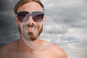 Composite image of portrait of handsome man wearing sunglasses