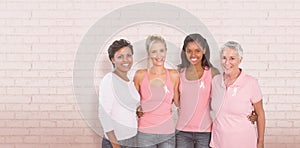 Composite image of portrait of happy women supporting breast cancer social issue