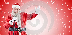 Composite image of portrait of santa claus singing christmas songs