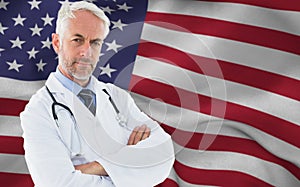 Composite image of portrait of a serious confident male doctor at medical office